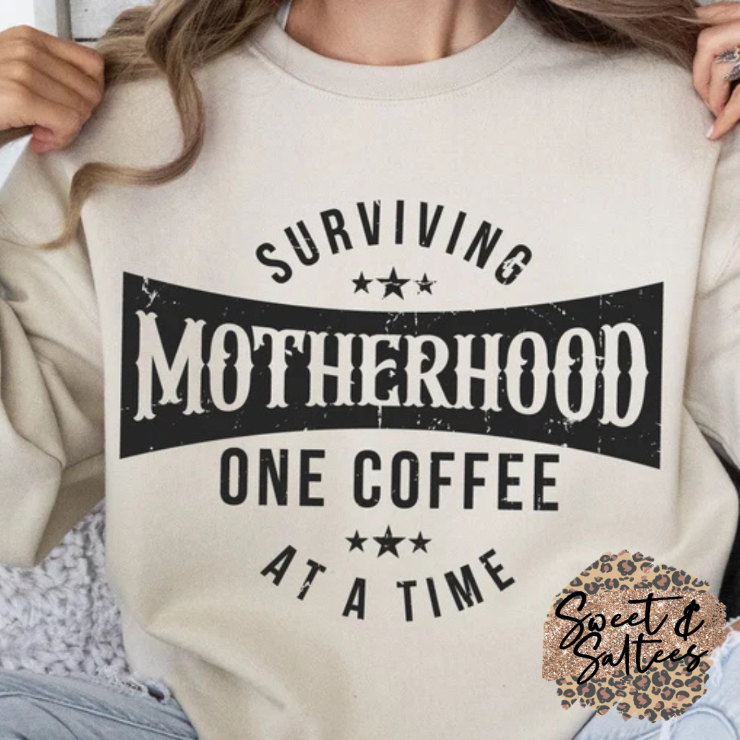 Surviving motherhood one coffee at a time t-shirt