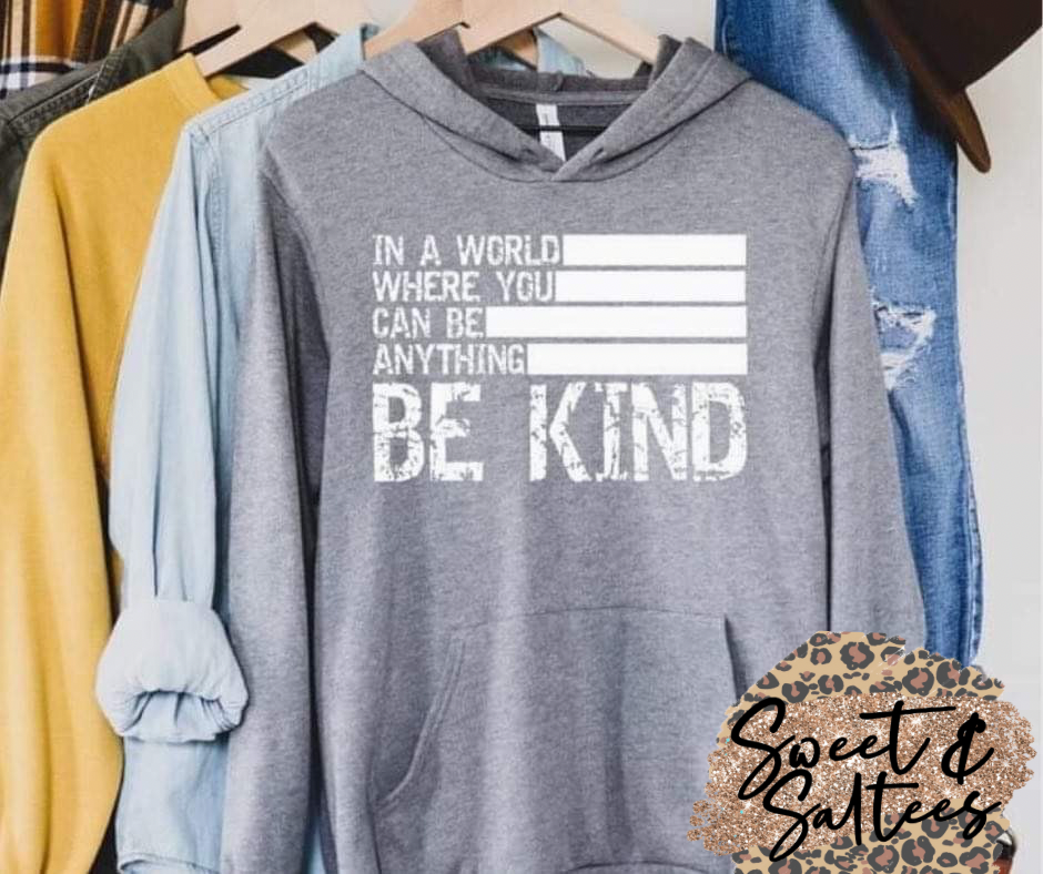 In a world where you can be anything, be kind white print graphic t-shirt